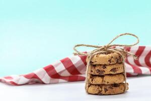 chocolate chunk cookies on a bright blue background photo