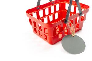 shopping cart with empty price tag isolated on white background photo