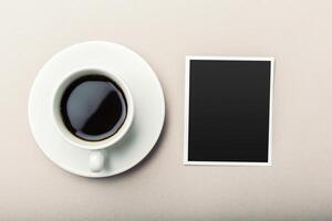 coffee and photo blank on the table.