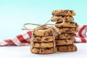 chocolate chunk cookies on a bright blue background photo