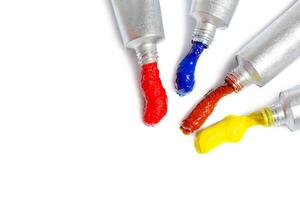 paint in tubes isolated on white photo