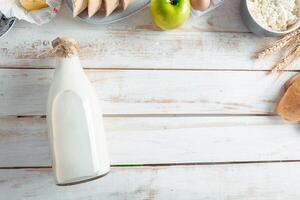 still life with dairy products, milk, eggs, bread photo
