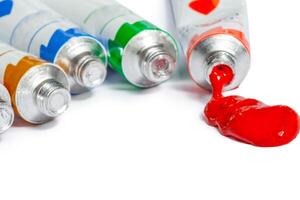 paint in tubes isolated on white photo