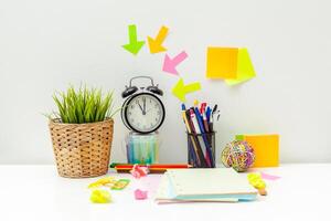 Work place of a creative person with a variety of colorful stationery objects photo