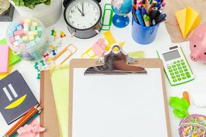 Work place of a creative person with a variety of colorful stationery objects photo