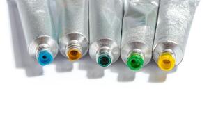 paint in tubes isolated on white photo