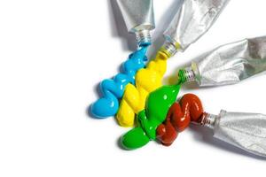 paint in tubes isolated on white photo