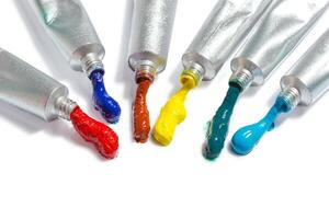 paint in tubes isolated on white photo