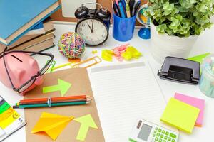 Work place of a creative person with a variety of colorful stationery objects photo