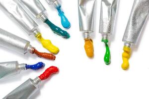 paint in tubes isolated on white photo