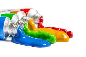 paint in tubes isolated on white photo