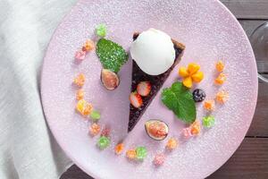 a slice of pie with vanilla ice cream photo