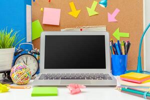 Work place of a creative person with a variety of colorful stationery objects photo