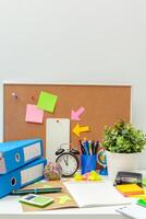 Work place of a creative person with a variety of colorful stationery objects photo
