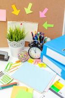 Work place of a creative person with a variety of colorful stationery objects photo
