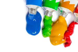 paint in tubes isolated on white photo