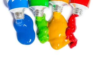 paint in tubes isolated on white photo