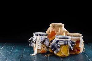 Homemade jars of fruits photo