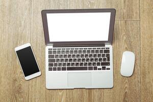 Office table with smartphone on it. View from above photo