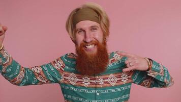 Overjoyed happy man showing rock n roll gesture by hands, cool sign, shouting yeah with crazy face video