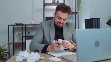 Angry furious man working at home office throwing crumpled paper, having nervous breakdown at work video