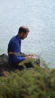 A Focused Professional Engaged in Work by the Refreshing Waters Edge, Finding Balance video