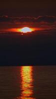 A Magnificent Sunset Reflection Spreading Over the Calm Waters Creates a Stunning Scene video