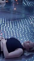 A Woman Meditating on an Illuminated Surface in a Peaceful and Serene Atmosphere video