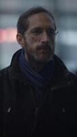 A Thoughtful Man Captured in a City Setting, Exuding Contemplation and Style Despite the Elements video