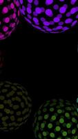 A Collection of Colorful PolkaDot Decorative Orbs Set Against a Striking Black Background video