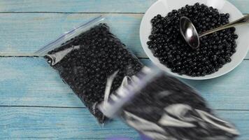 Packages with blueberries in zipper plastic bags for freezing. Frozen, preservation berries food video