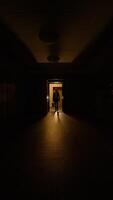 A Mysterious and Dimly Lit Corridor that features a Glow emanating from a Doorway video