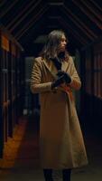 An Enigmatic Figure Standing Alone in a Dimly Lit and Shadowy Corridor of Mystery and Ambience video
