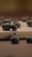 Fresh, Juicy Blueberries Nestled on a Rustic Wooden Surface Ready for Culinary Delights video