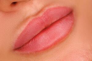 A close up of lips one month after the procedure. A soft pigment enhances the lip contours giving them a natural look after healing. photo