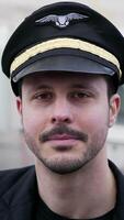 A Male Pilot Wearing a Uniform, Captured from Behind While Engaging in His Duties video