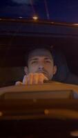 Nighttime Driving A CloseUp Portrait of a Focused and Attentive Driver in Action video