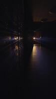 A Dimly Lit Hallway with a Mysterious Light Casting Shadows and Creating an Eerie Atmosphere video