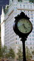 A nostalgic, vintage street clock beautifully placed in an urban environment, showcasing its charm video
