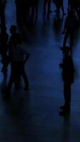 The Silhouetted Figures in a Dimly Lit Space Create a Unique and Engaging Atmosphere and Mood video