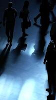 Silhouetted figures captured in dim lighting create an intriguing artistic atmosphere video