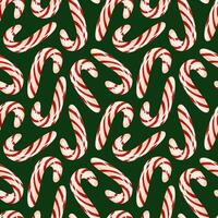 Seamless pattern with red and white striped candy cane on a green background. Ideal for Christmas design, holiday wrapping paper or festive decorations. vector