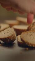 Artisan Bread Slices Beautifully Arranged on a Rustic Wooden Table Ready for Enjoyment video