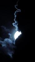 Ethereal moonlight breaks through clouds, creating a mystical ambiance and captivating beauty video