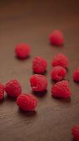 Fresh Raspberries Resting Beautifully on a Rustic Wooden Table in Natural Light Setting video
