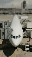 The airplane is currently stationed at the terminal and is ready for its upcoming departure video