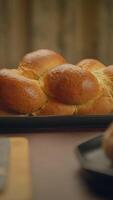 A Beautifully Freshly Baked Challah Bread Presented on a Rustic Wooden Table Surface video