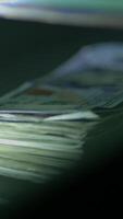 A detailed closeup view of neatly stacked currency notes and various important financial documents video