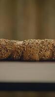 A beautiful closeup of Rustic Seed Bread displayed elegantly on a wooden table surface video