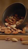 A Variety of Assorted Nuts Spilling from a Bowl, Creating a Colorful and Crunchy Display video